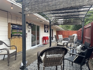 Awesome Outdoor Space with Lots of Seating, tables, TV, cooler, 2 grills