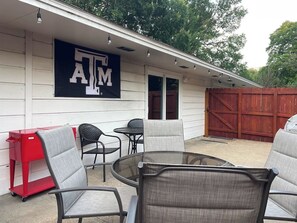 Side patio-perfect spot for your group! Drink Cooler, OutdoorTV, Globe lights! 