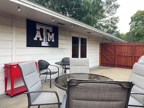 Side patio-perfect spot for your group! Drink Cooler, OutdoorTV, Globe lights!