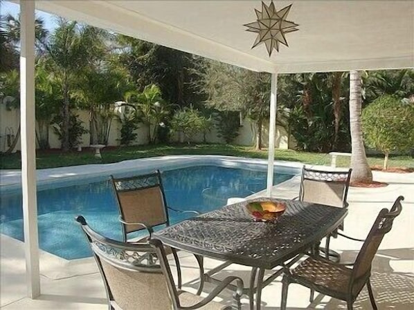 Covered Porch Overlooking Heated Pool !