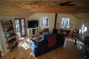 Great Room showing gas woodstove in back and ping pong table to right