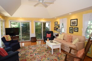 Large sunroom with five sliders and full insulated window quilts.