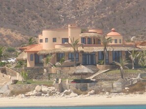 View from boat, main house, car at guesthouse. Optional main bedroom far left 