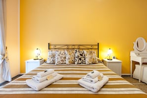 Twin bed in a room with balcony