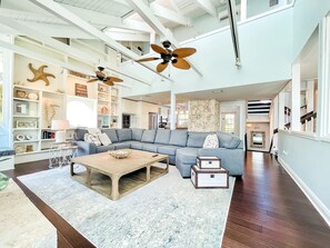 Bright and airy TV room with 80in TV. Perfect entertainment space.