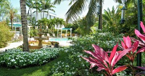 Heated Pool with Flower Gardens surrounding the Pool Deck
