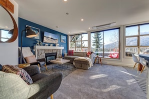 The living room couch stores the bedding and converts to sleeping for 2 guests.