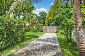 Gate opens to a private backyard also completely fenced-in.