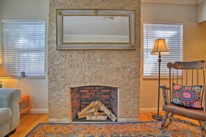 The decorative fireplace serves as the pièce de résistance in the living room.