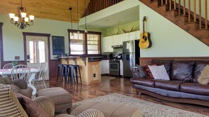 Open floor plan perfect for gathering.  House guitar in living room.