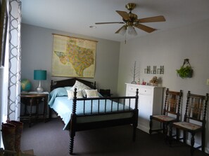 Antique full size bed in front bedroom. Entry door opens into this room.