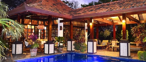 Breezeway and main house with pool. 