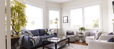 Inviting comfortable living room with West Elm gel mattress sleeper-sofa 