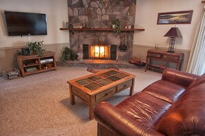 living room with gas log fireplace