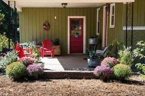 An outdoor lounging area, next to the garden, provides a nice restful space.