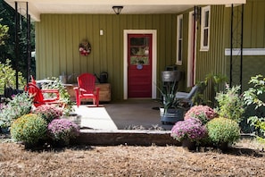 An outdoor lounging area, next to the garden, provides a nice restful space.