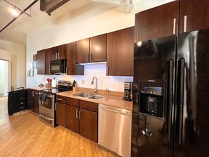 Full kitchen with standard coffee maker.