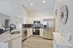 Stylish Kitchen with Granite and Stainless Steel Appliances