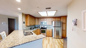 Well Equipped Kitchen with Custom Cabinetry