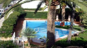 Birds eye view on the swimming pool, kids area below on the left side