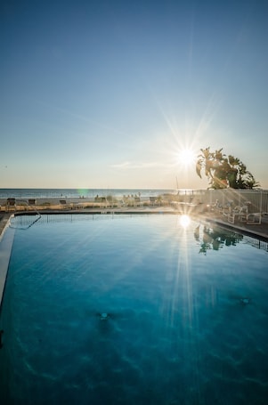 Pool overlooking the beach and sunsets.