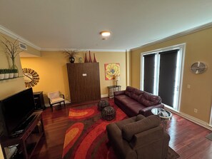 Living room showing queen Murphy Bed.