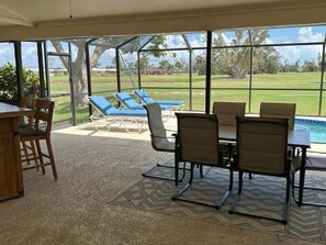 Large lanai with plenty of sun and shade, including bar space with t.v.