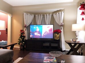 Spacious Living Room with 65’’ new LED Samsung TV, electronic clock, new TV stand, 2 new end tables, 2 new table lamps, new Coffee table, Amazon Echo Dot ( Alexa), new rugs, very comfortable new couch and cute pillows 
