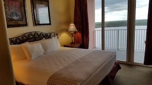 King bed in master bedroom with access to balcony