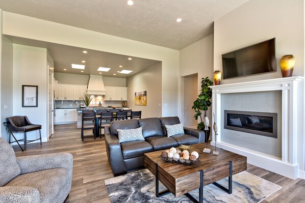 Living Room With View Of Kitchen - Beautiful view from the side door showing the living room, dining room, and kitchen.