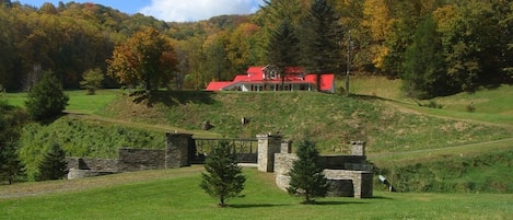 Enter the property through dry stacked stone gated entrance.