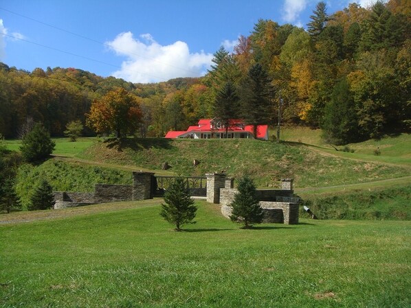 Enter the property through dry stacked stone gated entrance.