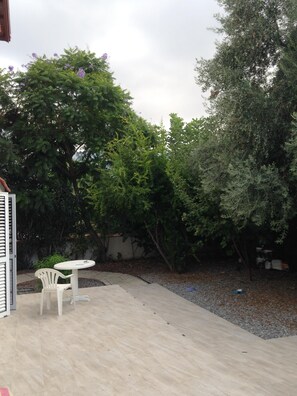 Front garden surrounded by trees