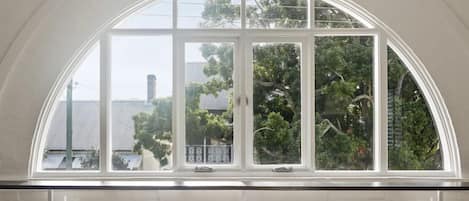 Beautiful arched window at front of apartment