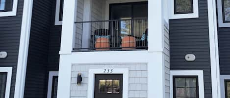 The front entryway with a relaxing porch above. The master bedroom is above it.