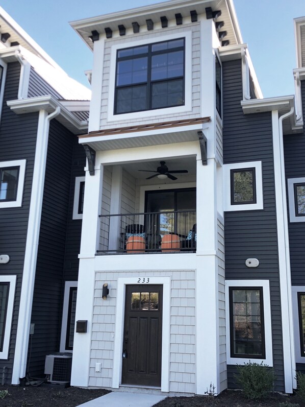 The front entryway with a relaxing porch above. The master bedroom is above it.