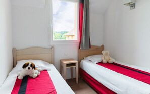 The second bedroom has 2 single beds.