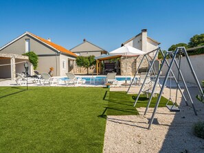 Sky, Plant, Building, Shade, Land Lot, Grass, House, Leisure, Tree, Landscape