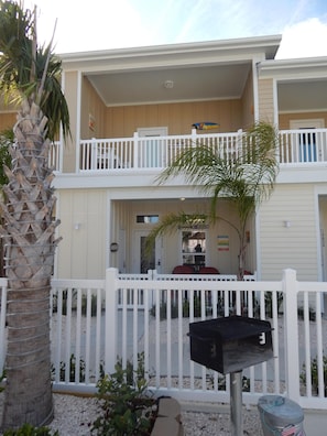 Front view of condo looking out door to BBQ