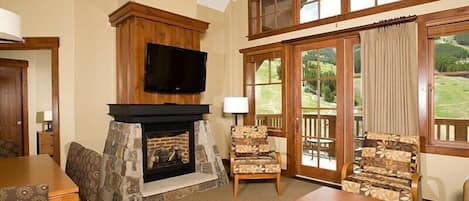 The living area features a sofabed and a murphy bed.