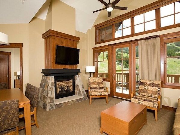 The living area features a sofabed and a murphy bed.