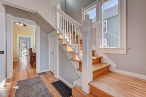 Foyer/entryway to dining room and stairs to second level