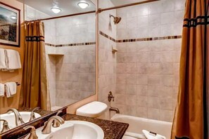 Get ready for the day ahead in the bright bathroom.