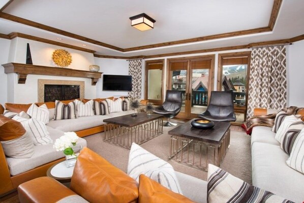 Relax and unwind with a movie or in front of the fireplace in the spacious living area