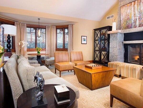 Relax and unwind with a movie or in front of the fireplace in the spacious living area.