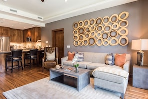 Kick back your feet and relax in the spacious, bright living room.