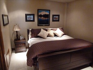 Beautiful bedroom with king mattress and down luxury bedding.