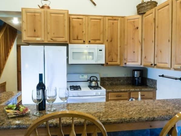 Take a seat at the breakfast bar and cook up a storm in the fully-equipped kitchen.