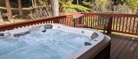 New Jacuzzi hot tub in 2022, off the back deck, main level queen bedroom.