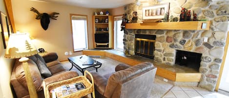 Living Room with River Rock Fireplace - Living Room with River Rock Fireplace